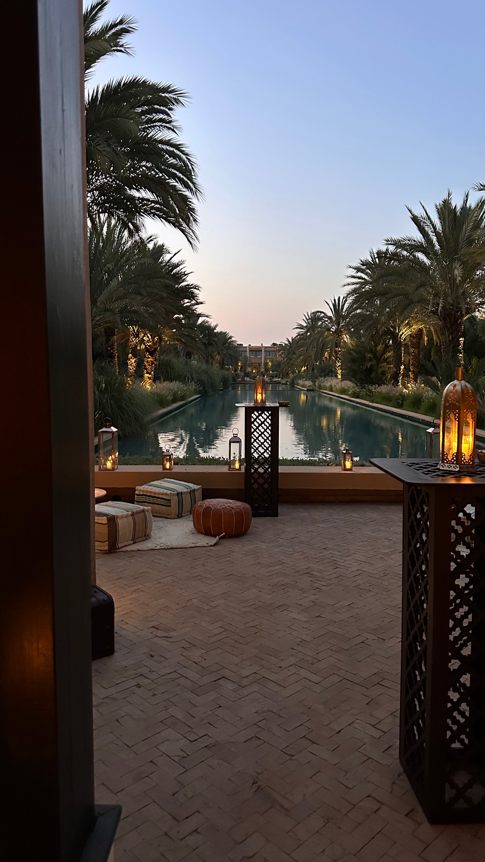 One Thousand and One Nights soirée at the Mandarin Oriental Marrakech — clouds of pierced brass lanterns, candlelit tablescapes and gold accents, produced by SBAI Events Production