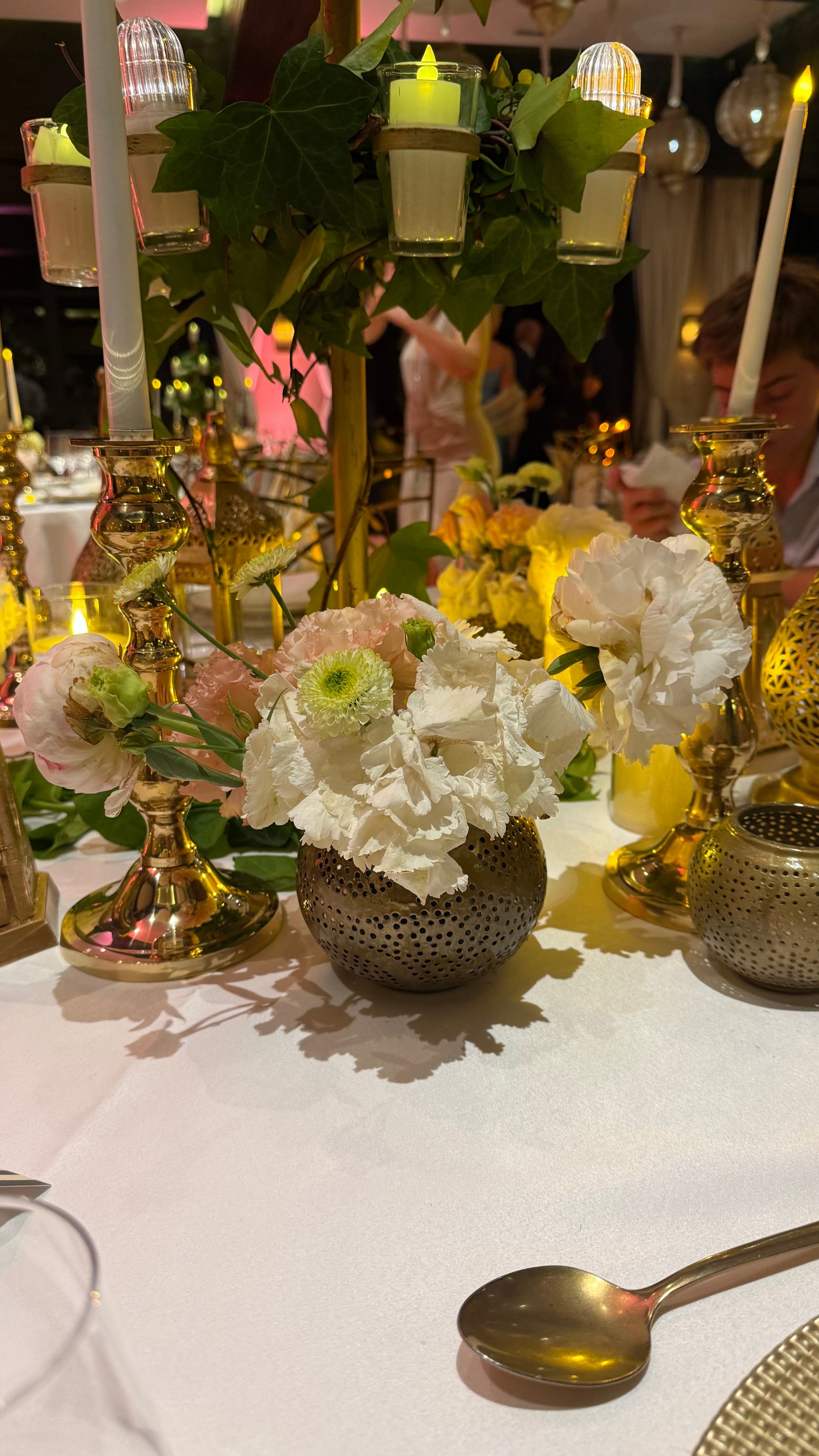 One Thousand and One Nights soirée at the Mandarin Oriental Marrakech — clouds of pierced brass lanterns, candlelit tablescapes and gold accents, produced by SBAI Events Production