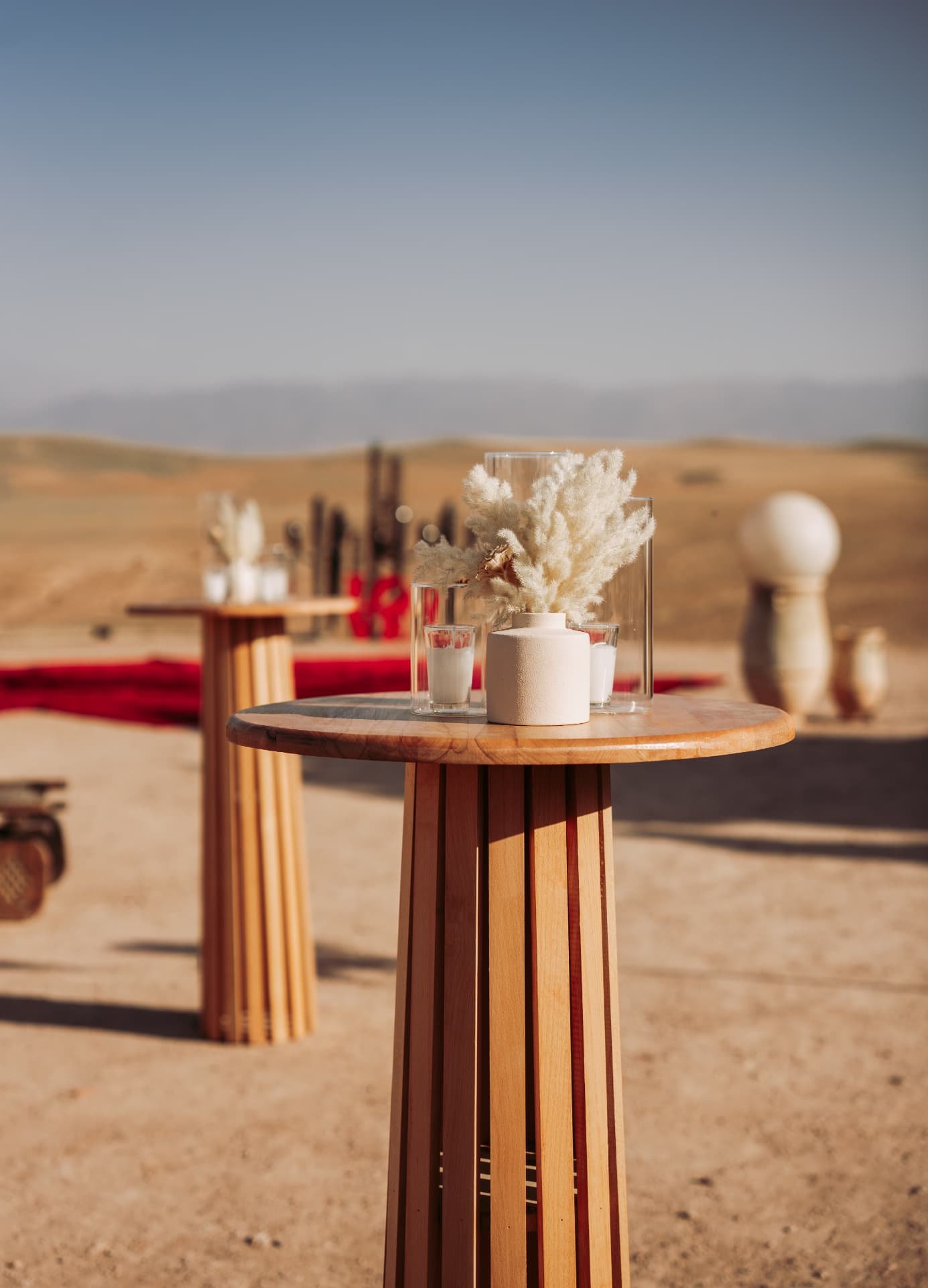 Celebration in the Agafay desert near Marrakech — equestrian performance in red, desert lounges, pampas tablescapes and fireworks, produced by SBAI Events Production
