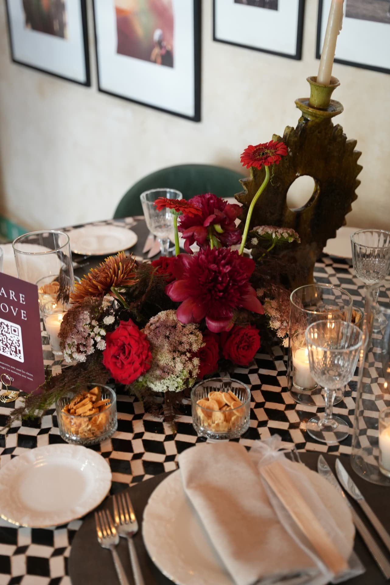 Wedding at Dar Dada Casablanca — gilded welcome mirror, crimson and burgundy floral centerpieces, zellige tables and candlelight, produced by SBAI Events Production